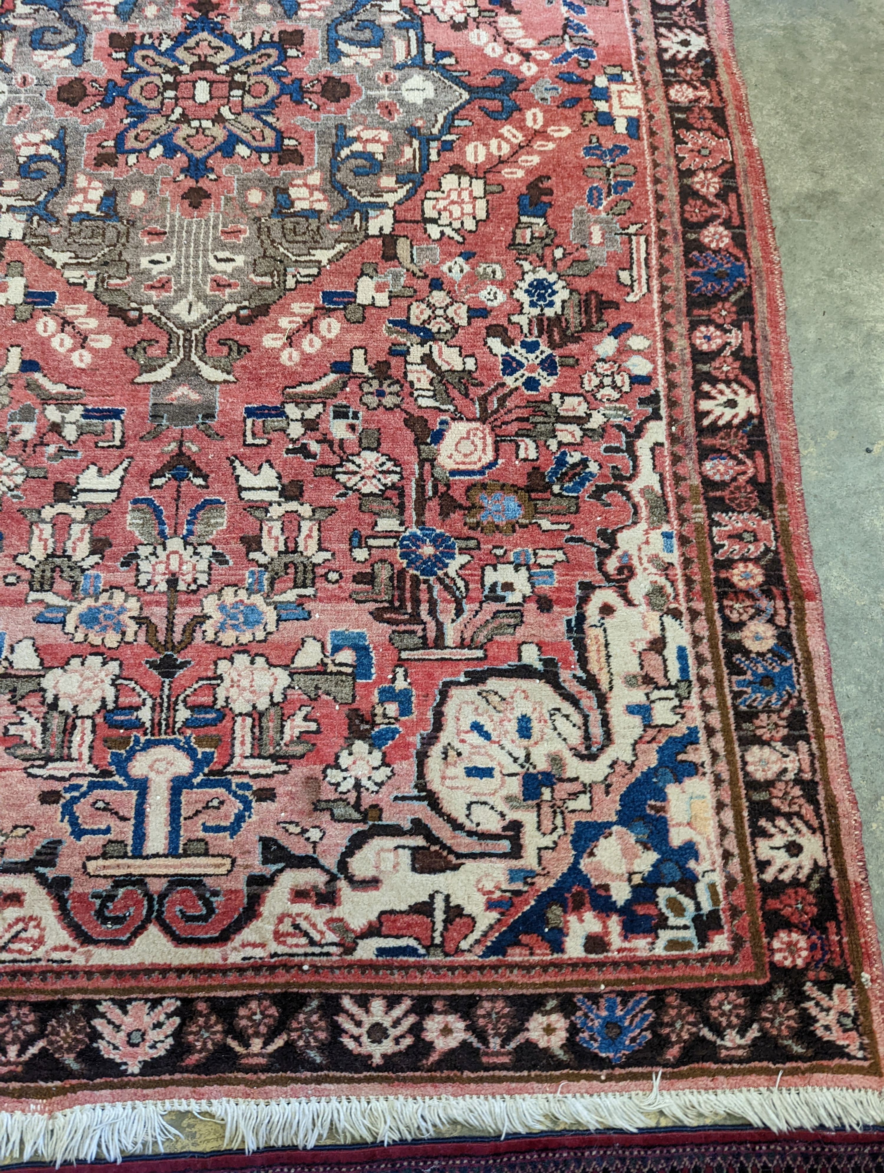 A North West Persian peach ground rug, 240 x 140cm